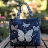 Quiltet mulepose med sølv sommerfugl