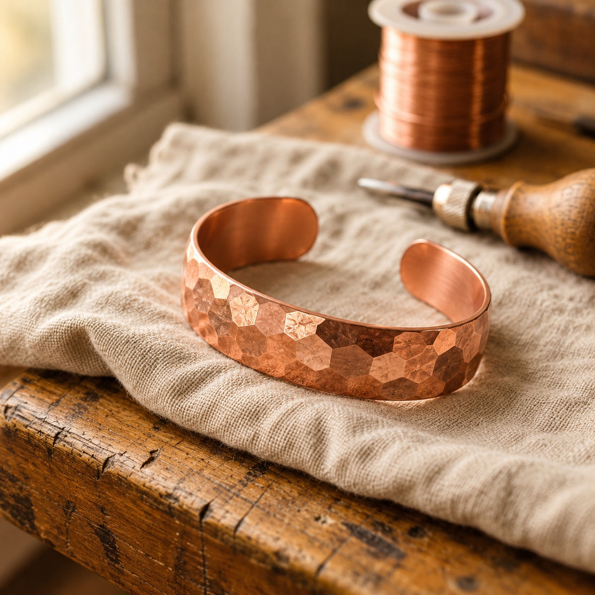 Veyra Hive Copper Bracelet on linen